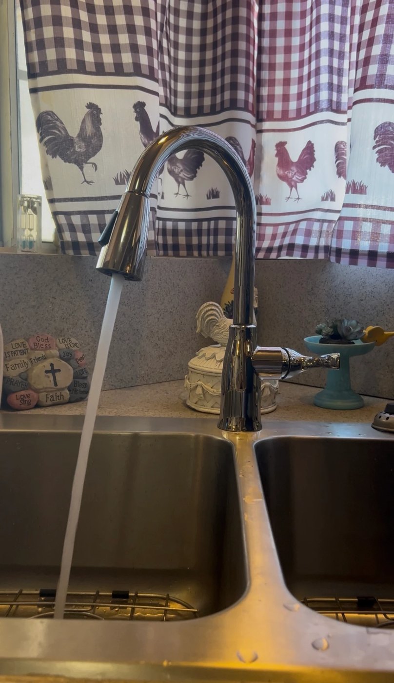 New kitchen faucet with water running
